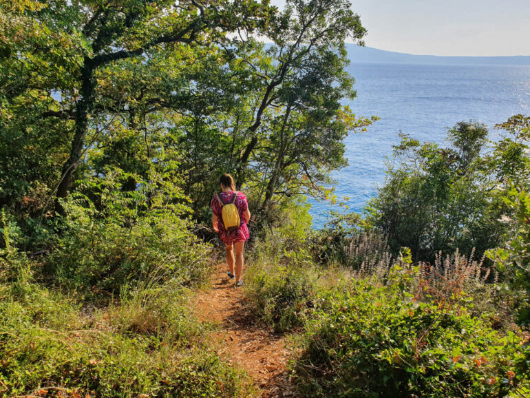 Elke walking close to the sea on the hiking trail from Novi Vinodolski to Selce