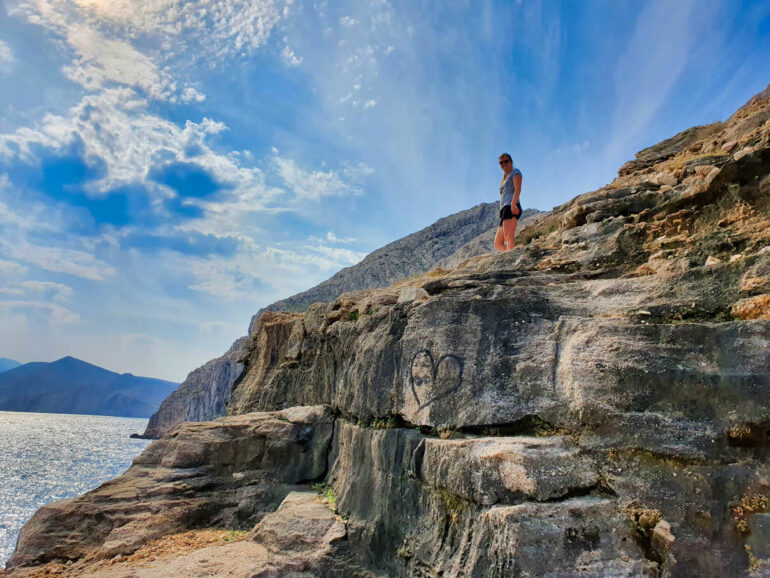 Elke on the rocks next to the sea