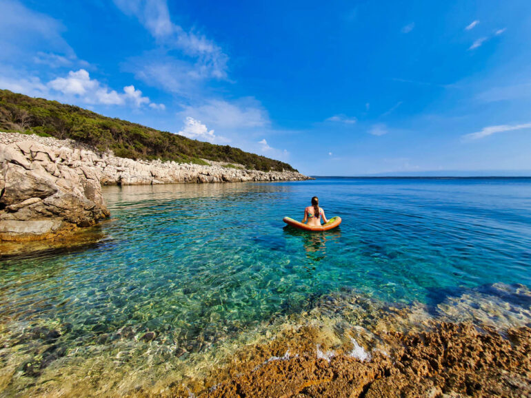 Elke on an air mattress in the sea in Lošinj