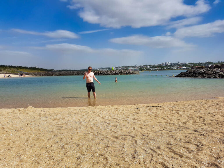 Steven in the sea in Reykjavik Nauthólsvík Geothermal Beach